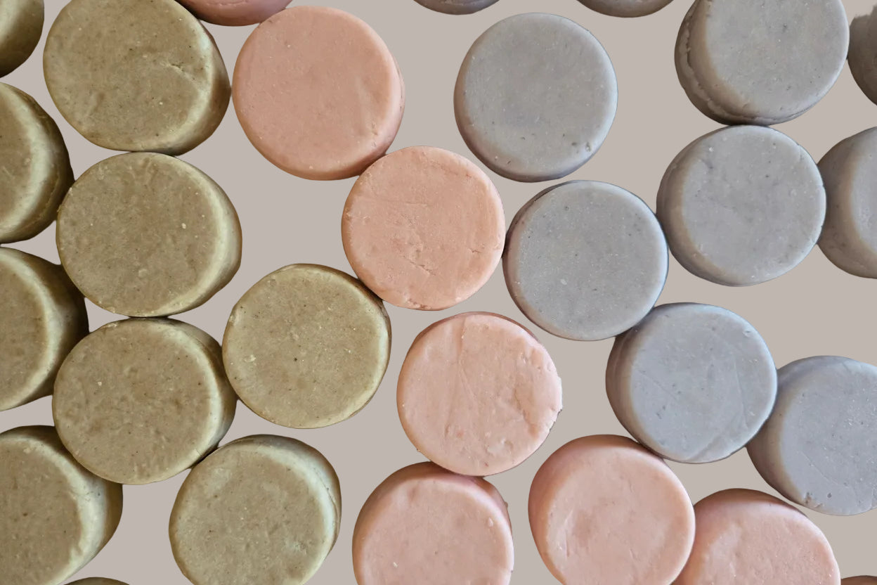Pattern of round, pastel-colored cookies on a beige background