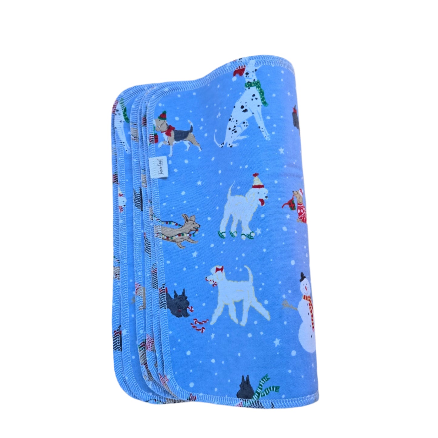 A stack of blue paperless towels with a winter dogs pattern, featuring various cartoon dogs and snowflakes.